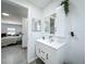 Bathroom featuring cabinet sink and mirrored medicine cabinet at 7033 Lakner Way, Orlando, FL 32822