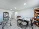 Dining area featuring light gray flooring and dining table at 7033 Lakner Way, Orlando, FL 32822