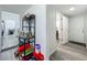 Hallway with light gray floors leading to the laundry room at 7033 Lakner Way, Orlando, FL 32822
