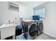 Laundry room with sink, washer and dryer at 7033 Lakner Way, Orlando, FL 32822