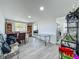 Spacious living room with dining area and light gray flooring at 7033 Lakner Way, Orlando, FL 32822