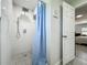Modern shower with gray tile flooring, rainfall shower head, and handheld sprayer at 7033 Lakner Way, Orlando, FL 32822