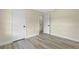 Empty bedroom featuring hardwood flooring and a double closet at 7360 Canal Dr, Sanford, FL 32771