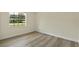 Spacious bedroom with hardwood flooring and a large window view at 7360 Canal Dr, Sanford, FL 32771
