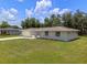 Inviting home with well-kept front yard, featuring an attached two-car garage at 7360 Canal Dr, Sanford, FL 32771