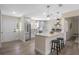 Modern kitchen featuring stainless steel appliances, a breakfast bar, and pendant lighting at 7360 Canal Dr, Sanford, FL 32771