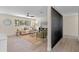Bright living room featuring wood flooring, neutral walls, and a large window at 7360 Canal Dr, Sanford, FL 32771