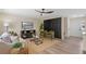 Relaxing living room featuring comfortable seating, wood flooring, and modern accents at 7360 Canal Dr, Sanford, FL 32771