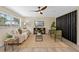 Inviting living room with wood flooring, stylish furniture, and natural light at 7360 Canal Dr, Sanford, FL 32771