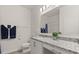 Bathroom with a granite countertop vanity and a shower-tub combo at 756 Rioja Dr, Minneola, FL 34715