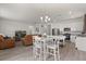 Open-concept space with kitchen, living, and dining areas, perfect for modern living at 756 Rioja Dr, Minneola, FL 34715