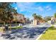 Gated community entrance with well-maintained landscaping at 7625 Long Island Dr, Kissimmee, FL 34747