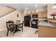 Warm kitchen with updated appliances, wood cabinets, tile floors and a cozy breakfast nook at 7625 Long Island Dr, Kissimmee, FL 34747
