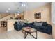Comfortable living room with tile floors, stylish sofas, and a ceiling fan at 7625 Long Island Dr, Kissimmee, FL 34747