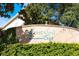Community entrance sign with landscaping and clear lettering at 7625 Long Island Dr, Kissimmee, FL 34747