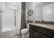 Bathroom featuring dark wood cabinets, a tub, and a shower at 7778 Four Seasons Blvd, Kissimmee, FL 34747