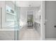 Bright bathroom featuring soaking tub with shower and double sink vanity at 7778 Four Seasons Blvd, Kissimmee, FL 34747