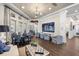 Spacious clubhouse lounge area featuring a large-screen TV and comfortable seating at 7778 Four Seasons Blvd, Kissimmee, FL 34747