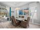 Dining room with decorative lighting, beachy decor, neutral colors, and a view to outdoor pool and patio at 7778 Four Seasons Blvd, Kissimmee, FL 34747