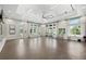 Well-lit exercise room featuring various exercise equipment and large windows for natural light at 7778 Four Seasons Blvd, Kissimmee, FL 34747
