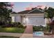Beautiful one-story home with manicured lawn and screened pool overlooking lush golf course at 7778 Four Seasons Blvd, Kissimmee, FL 34747