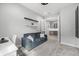 Comfortable home office with a cozy sofa, built-in desk, and convenient bar area at 7778 Four Seasons Blvd, Kissimmee, FL 34747