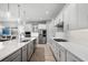 Modern kitchen with stainless appliances, white cabinets, and a gas range at 7778 Four Seasons Blvd, Kissimmee, FL 34747