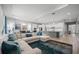 Open concept living room and dining room area with hardwood floors and neutral colors at 7778 Four Seasons Blvd, Kissimmee, FL 34747