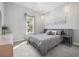 Calming main bedroom features a window view and pendant lighting at 7778 Four Seasons Blvd, Kissimmee, FL 34747