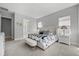This spacious main bedroom boasts neutral decor, plush carpeting, and ample natural light at 7778 Four Seasons Blvd, Kissimmee, FL 34747