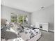 Bright main bedroom showcasing a decorative bed, plush carpeting, and ample natural light at 7778 Four Seasons Blvd, Kissimmee, FL 34747