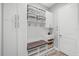 Convenient mud room area with a built-in bench and ample storage cabinets at 7778 Four Seasons Blvd, Kissimmee, FL 34747