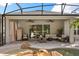 Covered patio with ceiling fans and outdoor furniture with a clear view of the pool at 7778 Four Seasons Blvd, Kissimmee, FL 34747