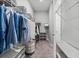 Well-organized walk-in closet featuring ample shelving and hanging space at 7778 Four Seasons Blvd, Kissimmee, FL 34747