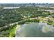 An aerial view of a neighborhood with lake access, a vibrant cityscape, and verdant trees at 820 Ellwood Ave # A, Orlando, FL 32804