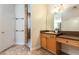 Bathroom featuring a vanity with a large mirror and tiled walk-in shower at 820 Ellwood Ave # A, Orlando, FL 32804