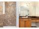 Bathroom showcasing a tiled walk-in shower and a vanity with a large mirror at 820 Ellwood Ave # A, Orlando, FL 32804