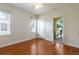 Bedroom featuring hardwood floors, natural light, and balcony access at 820 Ellwood Ave # A, Orlando, FL 32804
