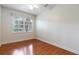 Bright bedroom with hardwood floors and a ceiling fan at 820 Ellwood Ave # A, Orlando, FL 32804