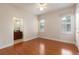 Bright bedroom with hardwood floors and an en-suite bathroom at 820 Ellwood Ave # A, Orlando, FL 32804