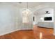 Bright dining room featuring wood floors and a unique chandelier at 820 Ellwood Ave # A, Orlando, FL 32804
