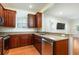 Kitchen with stainless steel appliances, wood cabinets, and granite counters at 820 Ellwood Ave # A, Orlando, FL 32804
