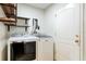 Convenient laundry room with modern washer and dryer, and open shelving at 820 Ellwood Ave # A, Orlando, FL 32804