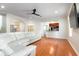 Cozy living space showcasing hardwood floors and access to the kitchen at 820 Ellwood Ave # A, Orlando, FL 32804