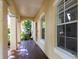 Spacious covered porch with wooden flooring and a view of lush landscaping at 820 Ellwood Ave # A, Orlando, FL 32804