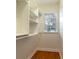 Spacious walk-in closet with built-in shelves and a window at 820 Ellwood Ave # A, Orlando, FL 32804