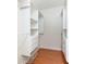 Walk-in closet with custom white shelving and hardwood floors at 820 Ellwood Ave # A, Orlando, FL 32804