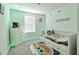 Themed bedroom with a decorative rug, accent lighting, and comfortable single bed at 832 Longboat Dr, Davenport, FL 33896