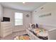 Stylized bedroom with whimsical decor and a cozy sleeping space with under-bed storage at 832 Longboat Dr, Davenport, FL 33896