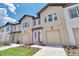 Attractive two-story townhouses with manicured lawns and coordinated exteriors and inviting front doors at 832 Longboat Dr, Davenport, FL 33896